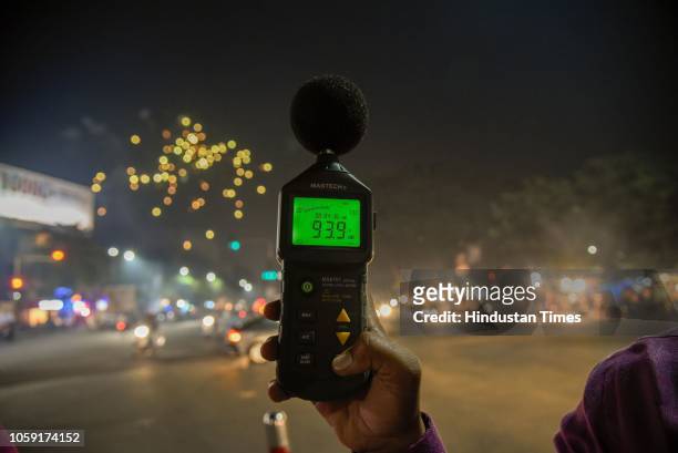 Officers check noise pollution levels at Karve Statue during Diwali Festival, on November 7, 2018 in Pune, India. Diwali is certainly one of the...