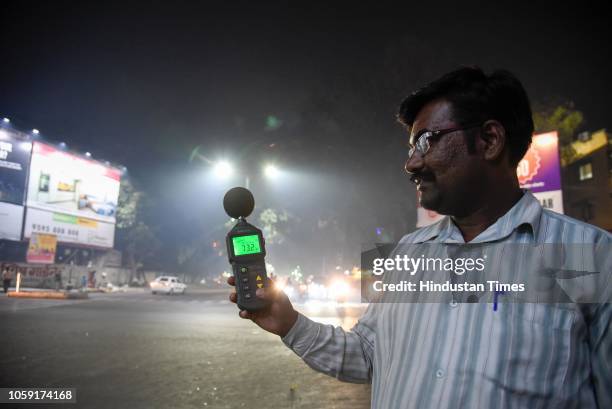 Officers check noise pollution levels at Karve Statue during Diwali Festival, on November 7, 2018 in Pune, India. Diwali is certainly one of the...