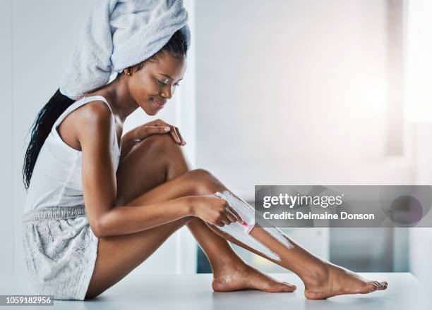 making sure my legs are smooth to the touch - hairy body woman stock pictures, royalty-free photos & images