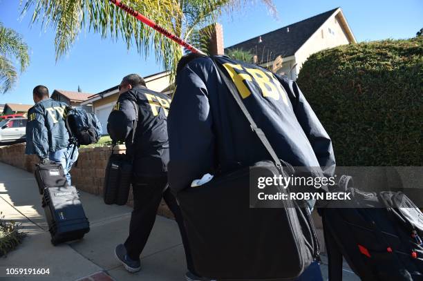 Investigators arrive at the home of suspected nightclub shooter Ian David Long on November 8 2018, in Thousand Oaks, California. - The gunman who...