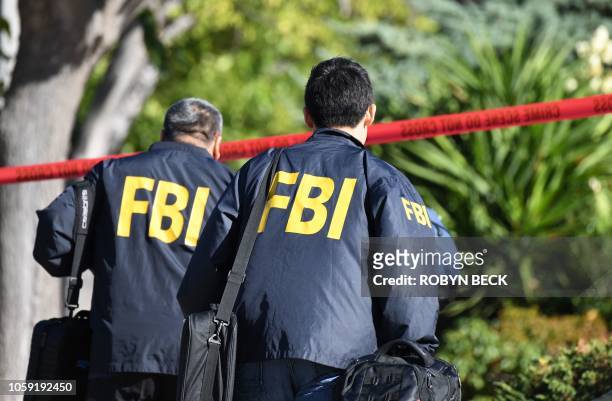 Investigators arrive at the home of suspected nightclub shooter Ian David Long on November 8 2018, in Thousand Oaks, California. - The gunman who...