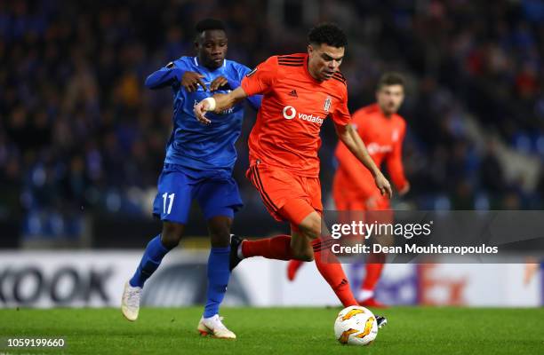 Pepe of Besiktas evades Joseph Paintsil of KRC Genk during the UEFA Europa League Group I match between KRC Genk and Besiktas at Cristal Arena on...