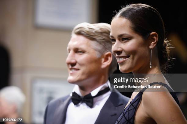 Bastian Schweinsteiger and his wife Ana Schweinsteiger arrive for the 20th GQ Men of the Year Award at Komische Oper on November 8, 2018 in Berlin,...