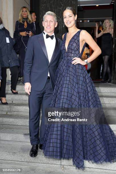 Bastian Schweinsteiger and his wife Ana Schweinsteiger arrive for the 20th GQ Men of the Year Award at Komische Oper on November 8, 2018 in Berlin,...