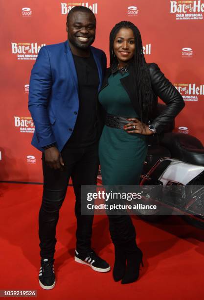 November 2018, North Rhine-Westphalia, Oberhausen: Footballer Gerald Asamoah and his wife Linda come to the Stage Metronom Theater for the premiere...