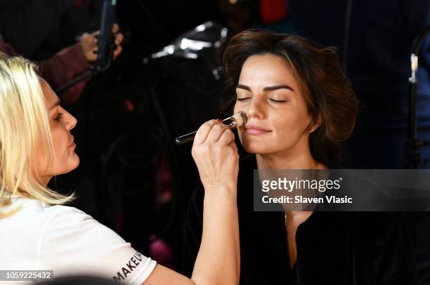 Model Barbara Fialho prepares backstage for hair and makeup at 2018 Victoria's Secret Fashion Show at Pier 94 on November 8, 2018 in New York City.