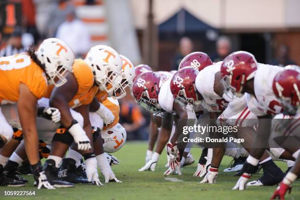 Tennessee Volunteers and Alabama Crimson Tide on the line of scrimmage during the first half of the game between the Alabama Crimson Tide and the...