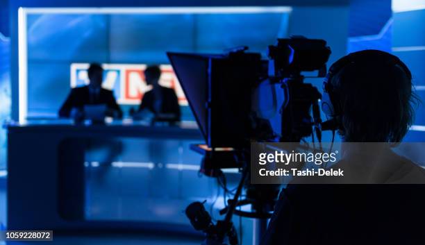 newsreaders in television studio - journalism stock pictures, royalty-free photos & images