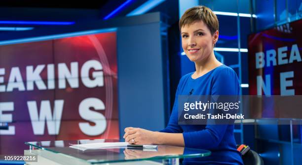 female newsreader in studio - newscaster stock pictures, royalty-free photos & images