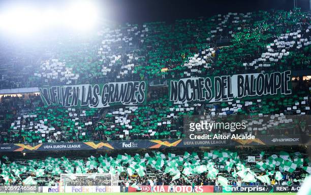 Fans of Real Betis Balompie cheer for their team during the UEFA Europa League Group F match between Real Betis and AC Milan at Estadio Benito...
