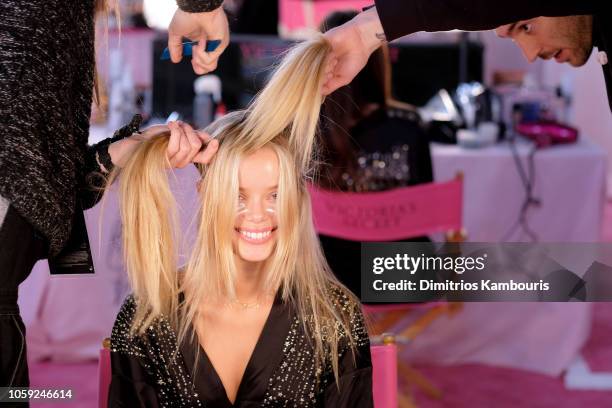 Frida Aasen prepares backstage during the 2018 Victoria's Secret Fashion Show in New York at Pier 94 on November 8, 2018 in New York City.