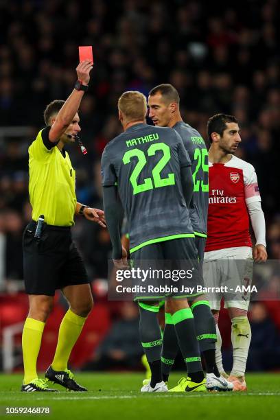 Jeremy Mathieu of Sporting CP receives a straight red card during the UEFA Europa League Group E match between Arsenal and Sporting CP at Emirates...
