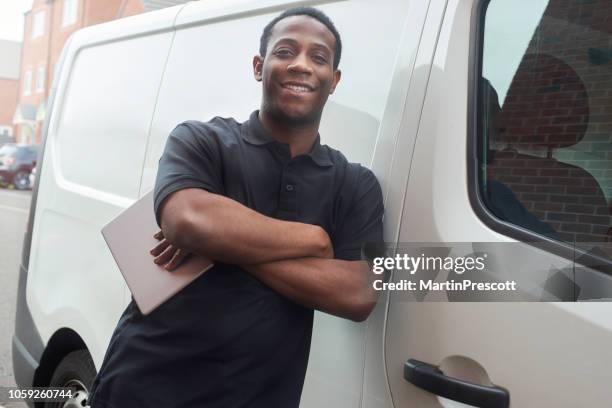 smiling tradesman stood at van - plumber van stock pictures, royalty-free photos & images