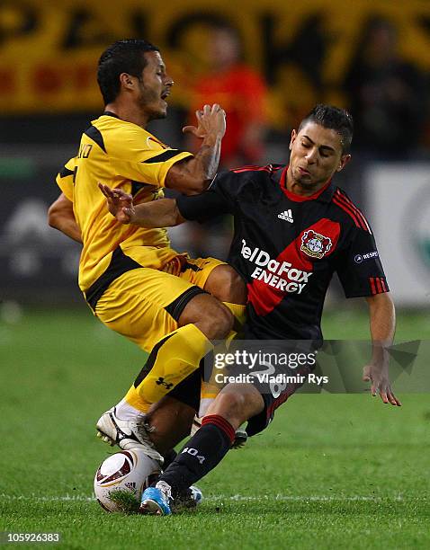 Burak Kaplan of Leverkusen and Juan Carlos Toja of Aris battle for the ball during the UEFA Europa League Group B match between Aris Thessaloniki FC...