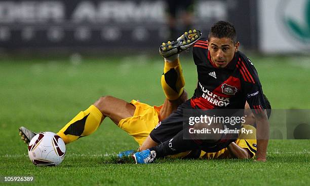Burak Kaplan of Leverkusen and Juan Carlos Toja of Aris battle for the ball during the UEFA Europa League Group B match between Aris Thessaloniki FC...