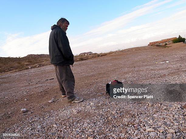 Homeless man waits for a ride out of Las Vegas on October 21, 2010 in Las Vegas, Nevada. As of a 2009 census, Las Vegas had a homeless population of...