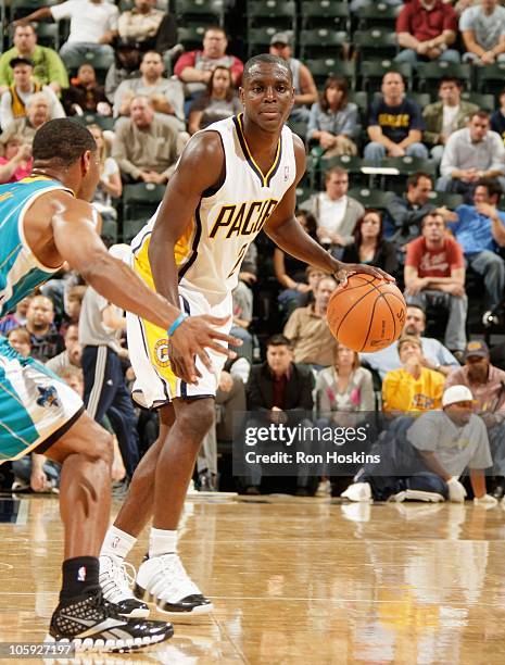 Darren Collison of the Indiana Pacers handles the ball during a game against the New Orleans Hornets on October 15, 2010 at Conseco Fieldhouse in...