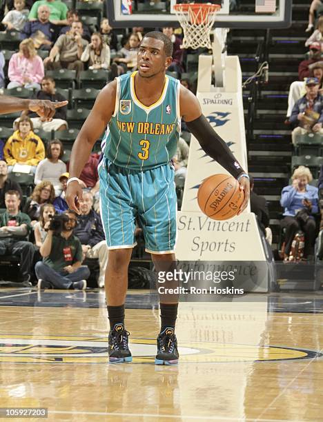 Chris Paul of the New Orleans Hornets handles the ball during a game against the Indiana Pacers on October 15, 2010 at Conseco Fieldhouse in...