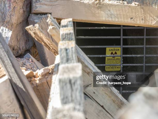 "caution - radiation area" sign in a uranium mine - uranium mine stock pictures, royalty-free photos & images