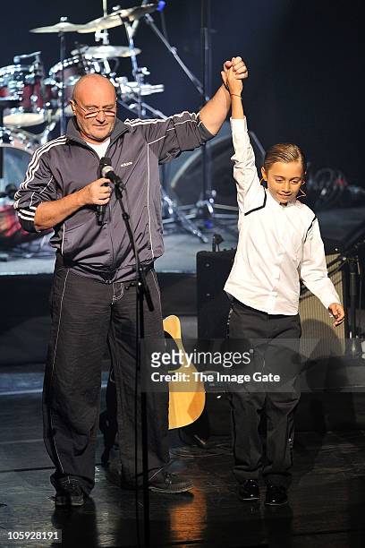 Phil Collins thanks his son Nicholas Collins, who played the drums, as his father was unable to perform due to his hand condition, during the Little...