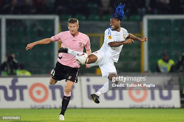 Dorin Goian of Palermo and Vagner Love of CSKA Moscow compete for the ball during the UEFA Europa League Group F match between US Citta di Palermo...