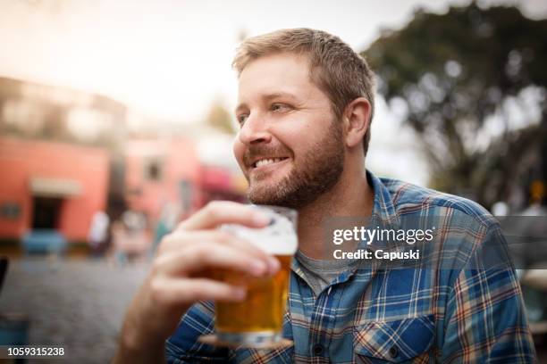 man drinking beer at the bar - buenos aires palermo stock pictures, royalty-free photos & images