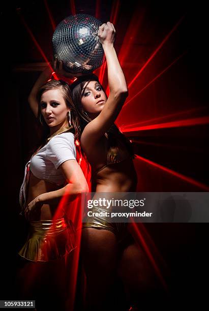 gogo dancers in laser light - go go dancer stock pictures, royalty-free photos & images