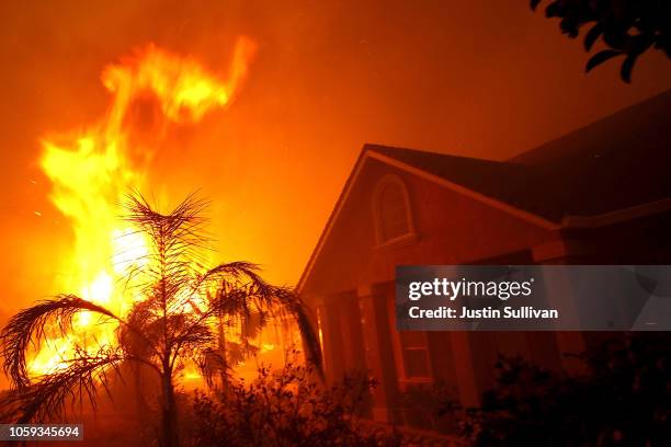 Home burns as the Camp Fire moves through the area on November 8, 2018 in Paradise, California. Fueled by high winds and low humidity, the rapidly...