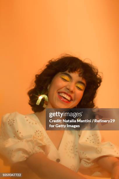 portait of a young confident latin american woman laughing - latin beauty stockfoto's en -beelden