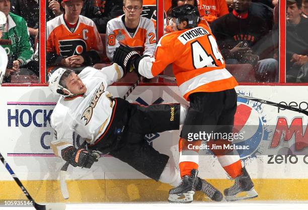 Bobby Ryan of the Anaheim Ducks takes a hit from Kimmo Timonen of the Philadelphia Flyers on October 21, 2010 at Wells Fargo Center in Philadelphia,...