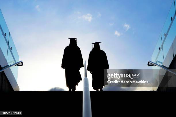 college graduation - stepping into the future - last day of school stock pictures, royalty-free photos & images