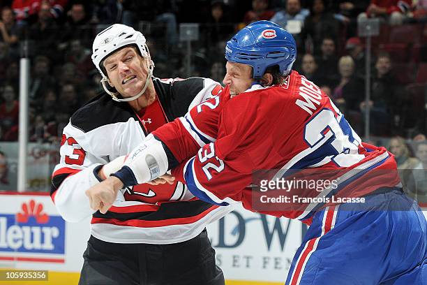 Travis Moen of the Montreal Canadiens and David Clarkson of the the New Jersey Devils fight during the NHL game on October 21, 2010 at the Bell...