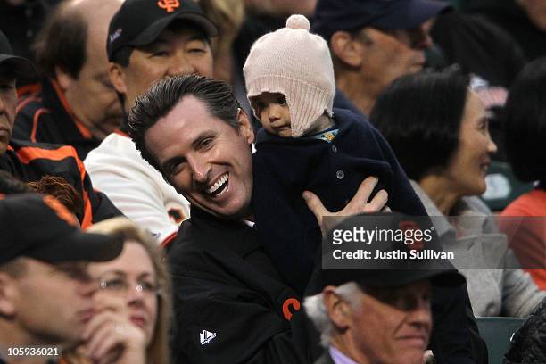 San Francisco Mayor Gavin Newsom holds his daughter Montana Tessa Newsom in the stands during Game Five of the NLCS during the 2010 MLB Playoffs...