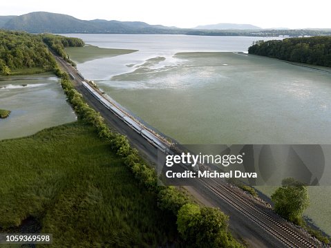 Passenger train traveling up the hudson river