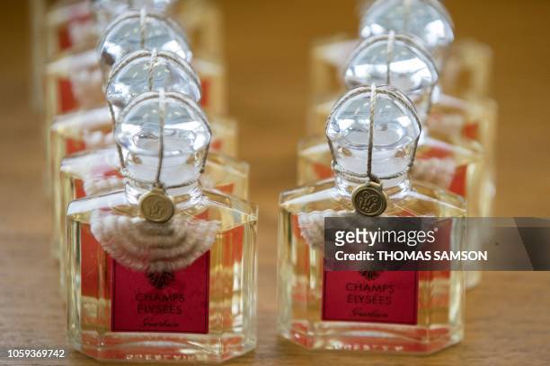 Picture taken on November 6, 2018 shows manufactured bottles of perfume at the Guerlain factory in Orphin, south of Paris. Less than 2% of Guerlain's...