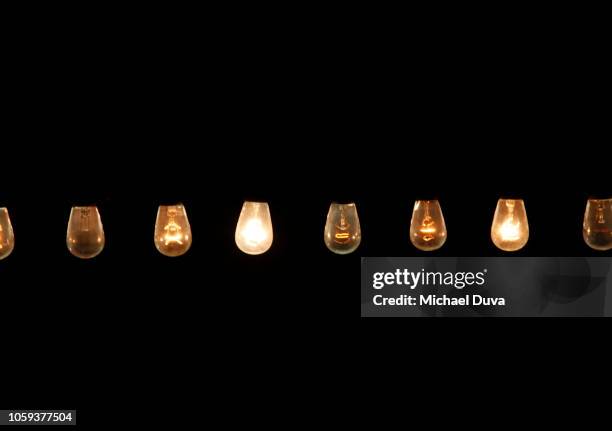 line of lights in a row - lightbulbs in a row stock pictures, royalty-free photos & images