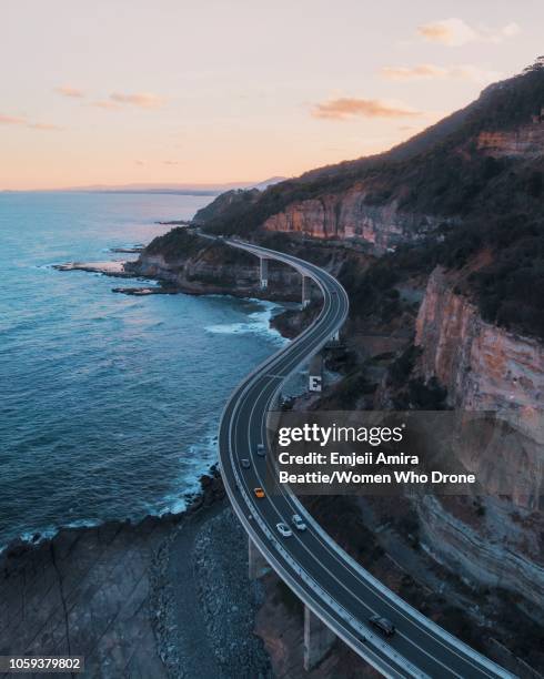 sea cliff bridge during sunset - coastal road stock pictures, royalty-free photos & images