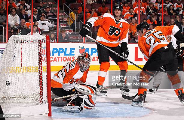 Sergei Bobrovsky of the Philadelphia Flyers surrenders a first period goal against the Anaheim Ducks as teammates Chris Pronger and Matt Carle look...