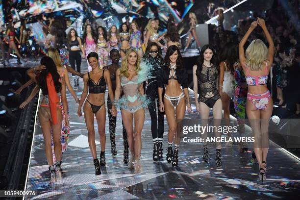 Models Jourdana Phillips, Grace Bol, Megan Williams, Lameka Fox, Bella Hadid, and Sui He walk the runway at the 2018 Victoria's Secret Fashion Show...
