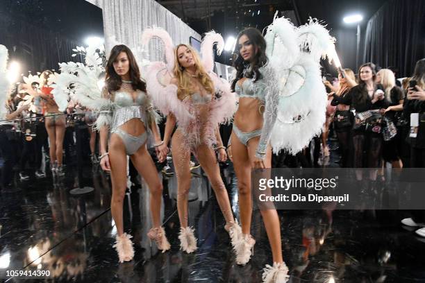 Bella Hadid, Martha Hunt and Kelly Gale pose backstage during the 2018 Victoria's Secret Fashion Show at Pier 94 on November 8, 2018 in New York City.