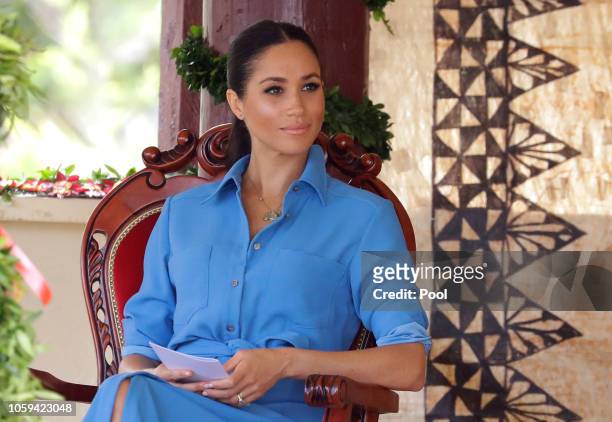 Meghan, Duchess of Sussex talks with students during a visit to Tupou College in Tonga on October 26, 2018. Prince Harry and his wife Meghan are on...