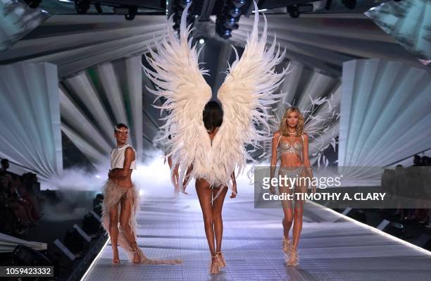 Swedish model Elsa Hosk walks the runway past Halsey as she performs at the 2018 Victoria's Secret Fashion Show on November 8, 2018 at Pier 94 in New...