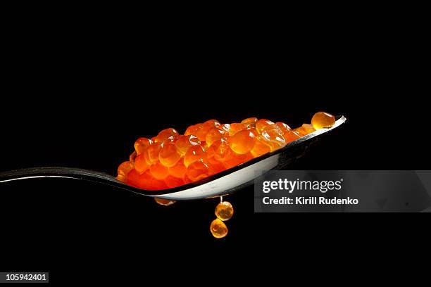 red caviar in the spoon - kaviar stock-fotos und bilder