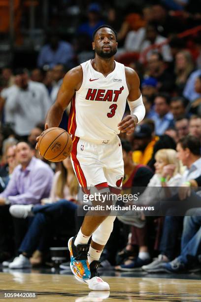 Dwyane Wade of the Miami Heat dribbles with the ball against the New York Knicks during the second half at American Airlines Arena on October 24,...