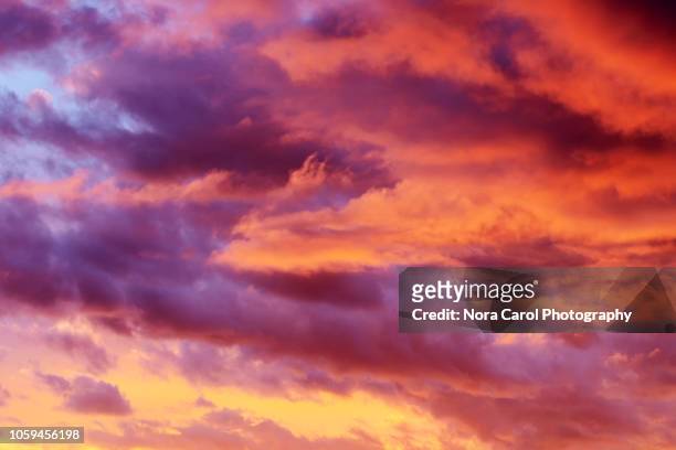 colorful sunset clouds background - romantic sky stock pictures, royalty-free photos & images