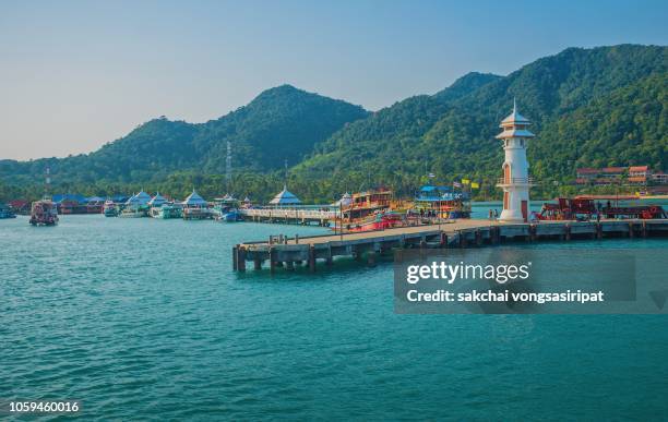 scenic view lighthouse on pier at ban bang bao fishing village in koh chang, thailand - andaman islands stock pictures, royalty-free photos & images