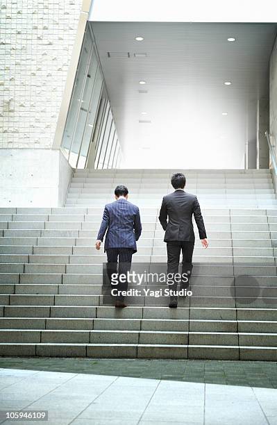 two office workers who go up the stairs  - 階段　のぼる ストックフォトと画像