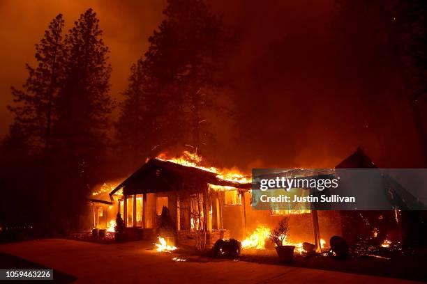 Home burns as the Camp Fire moves through the area on November 8, 2018 in Paradise, California. Fueled by high winds and low humidity, the rapidly...