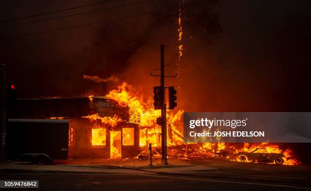 Store burns as the Camp fire tears through Paradise, California on November 8, 2018. A rapidly spreading, late-season wildfire in northern California...