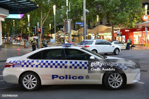 Police take security measurement after a man has been shot by police after setting his car on fire and stabbing several people in Melbourne,...